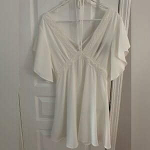 White Mini Dress. Halter Tie. Criss Cross Back & Zipper Closure. Size M. NWT.